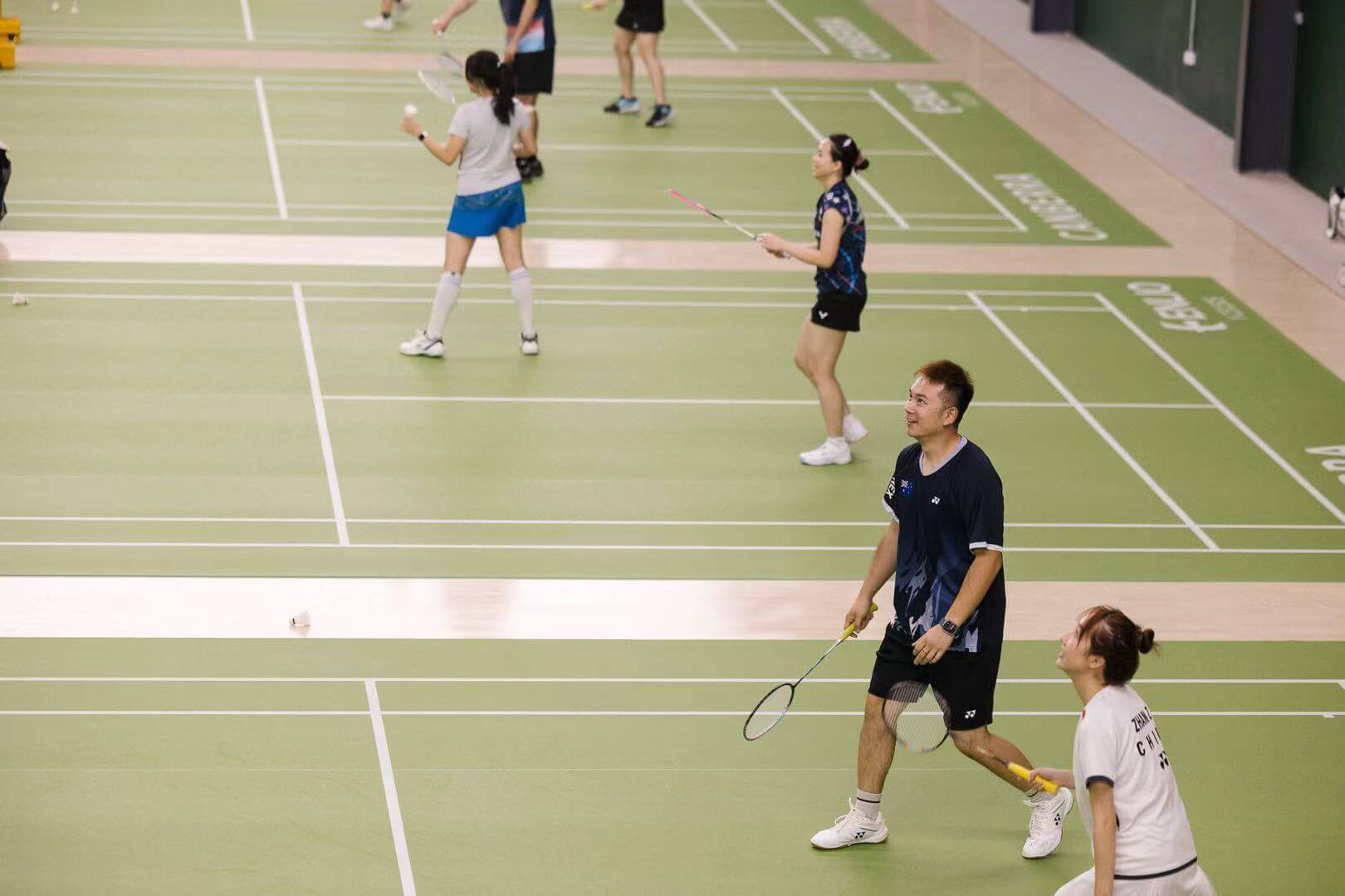 Players on the courts at CBR Badminton Centre